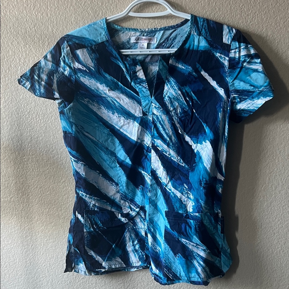 Koi Women's scrub top in Blue and White Pattern